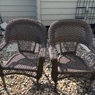 Pair of woven wicker armchairs