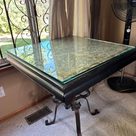 Wrought-iron table with glass top